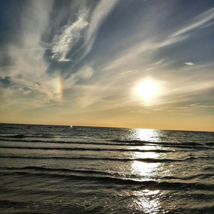 Sonnenaufgang mit Regenbogen